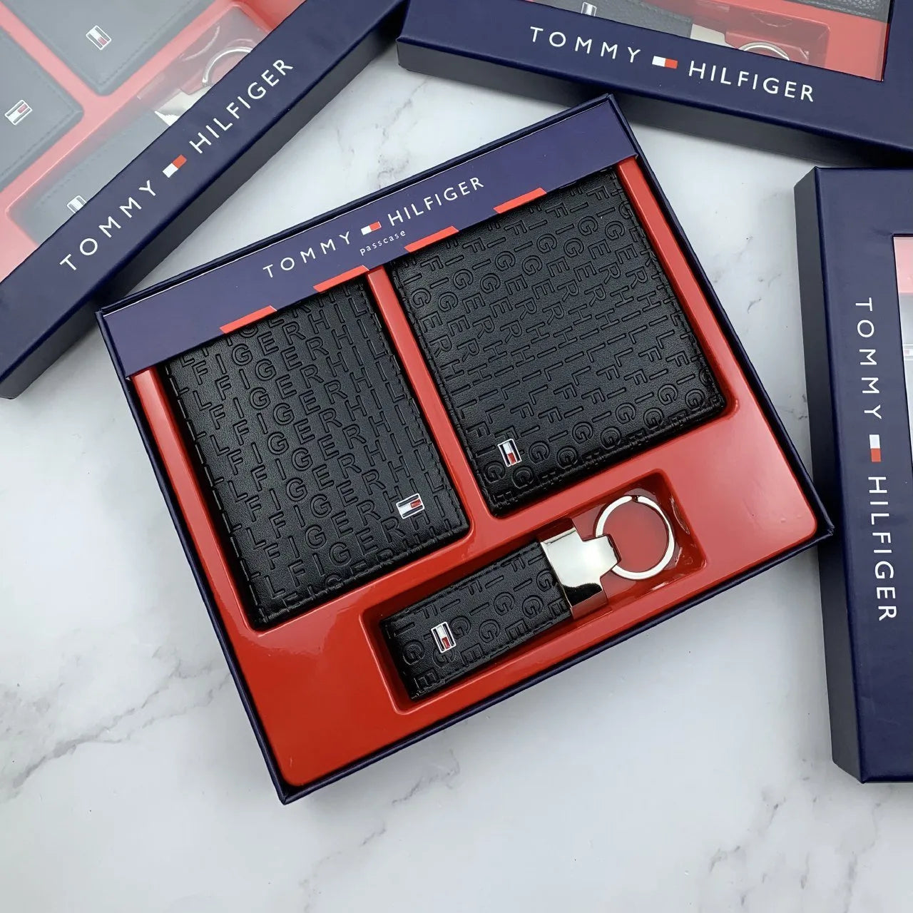 Tommy Hilfiger men's wallet, card holder, and keychain set.